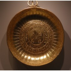 Metal solar disc with a cross in the center